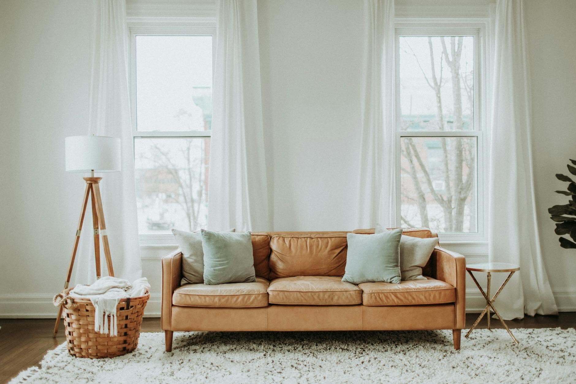 Minimalist Vs. Maximalist: Finding Your Home Style 1 white and brown sofa chair near white window curtain
article minimalist vs. maximalist design